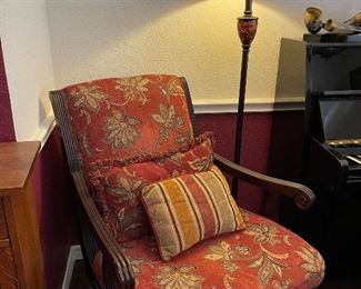 Wood framed arm chair with great upholstery, floor lamp