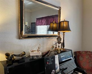 Black and gold mirror, music boxes, animal horn accent pieces