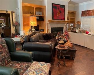 Looking across the living room. vintage table lamp with original shade, hand carved accent table, wood bowls