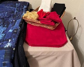 Very nice table linens with matching table cloths hanging in the closet