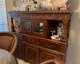 Wonderful hutch with a lighted center cabinet, lots of storage and nice carved details