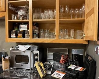 Lots of stem ware, Wolfgang Puck Kitchentex pressure oven, Wolfgang Puck three in one  peeler, corer, slicer, Wolfgang Puck steamer for veg and meat, Sunbeam mixer