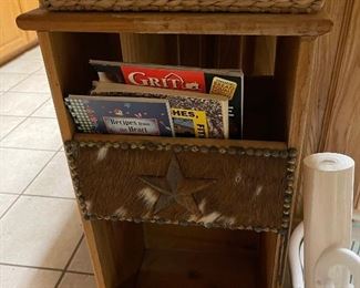 Storage piece with cow hide accent details