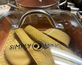 Simply Ming cook ware with silicone heat guards