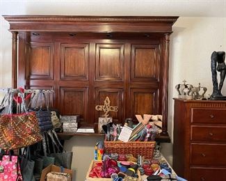 Wonderful lighted head board, lots of great jewelry pouches, and designer bags