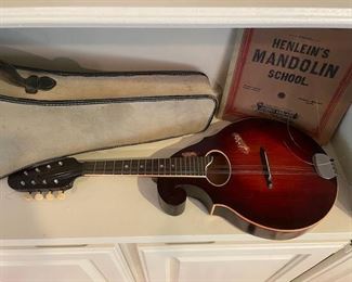 Vintage mandolin with case and book