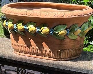 A very large Tuscan terracotta planter with lemon and bloom glazed motif