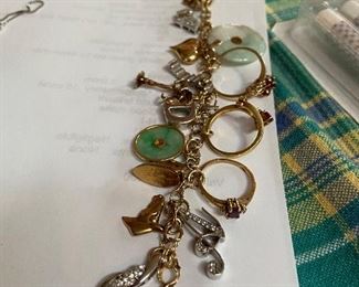 14k charm bracelet with precious stone charms