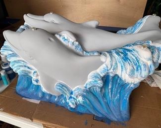 Dolphin coffee table with oval glass top
$100