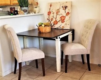 Drop down sides new dining table and 2 beige chairs. Perfect for small spaces.