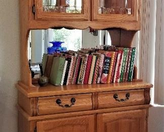 Small china hutch with light. Great for fitting in many places.