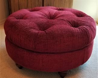 La-z-boy deep red round ottoman great for a coffee table by adding a tray or round piece of glass on top.