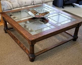 Square glass and wood coffee table. Beautiful etched glass and bottom shelf for extra storage.