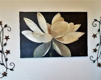 Canvas art and metal decor flowers. Put them together or on each side or place them at the top and bottom of a piece of art.
