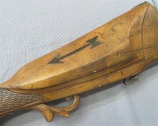 Brass inlays on both sides of the stock of this percussion rifle