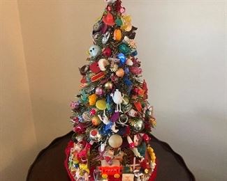 Small Christmas tree decorated with Cracker Jack/bubble gum machine toys!
