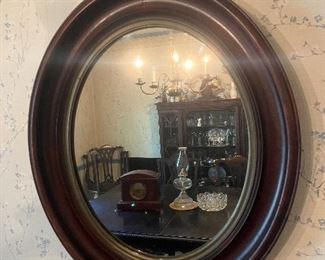 Wood framed oval wall mirror