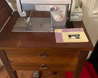 Singer sewing machine in cabinet