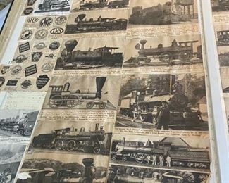 Large book filled with Train clippings from newspaper