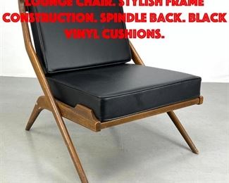 Lot 137 Folke Ohlsson Scissor Lounge Chair. Stylish Frame Construction. Spindle Back. Black Vinyl Cushions.