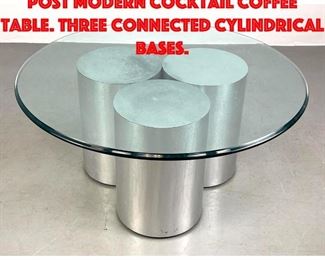 Lot 167 Round brushed chrome post modern cocktail coffee table. Three connected cylindrical bases.