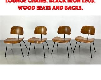 Lot 210 Set 4 Charles Eames LCM Lounge Chairs. Black Iron Legs. Wood Seats and backs.