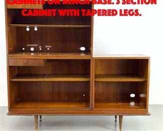 Lot 353 Mid Century Modern Cabinets on Bench Base. 3 Section Cabinet with tapered legs.