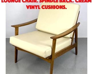Lot 417 Modernist Sloped Open Arm Lounge Chair. Spindle back. Cream vinyl Cushions.
