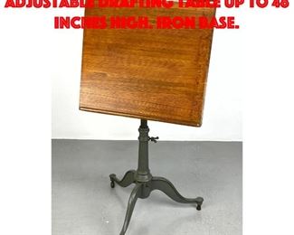 Lot 436 Early 20th century adjustable drafting table up to 48 inches high. Iron base.