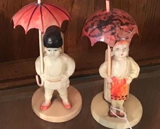 Pair of Celluloid Figures with Umbrellas Possibly Toothpick Holders or Bud Vases