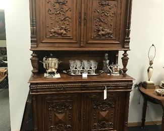 1880’s Walnut Sideboard with carved griffins on the top doors, bottom doors are intricately carved also. The piece is doweled not a screw or nail in it. Pristine condition ! On Sale the next 2 weeks. Open Tuesday by appointment, as well as Sat and Sun. 10-5