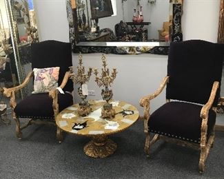 Huge Venetian Mirror with Hand Painted Roses
Large Purple Velvet Chairs
Mid Century Unique Gold and Silver Round Coffee Table
I’m Bronze and Marble Candelabras with Cupids