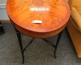 Beautiful oval burled oval table with inlaid Greek key apron.