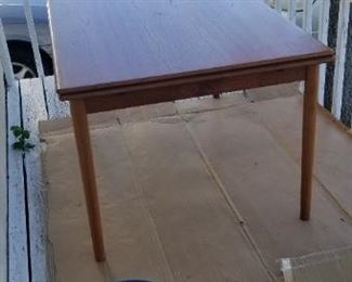 Danish mid-century modern dining table with two hidden leaves. Approx. 37" x 56" as shown; expands to 8 ft.