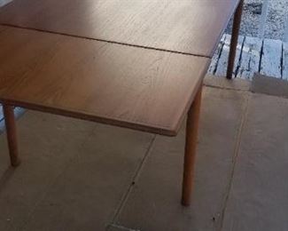 Mid-century modern Danish dining table is 96" when fully extended