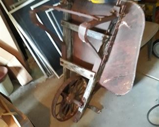 Vintage garden planter  metal wheelbarrow 