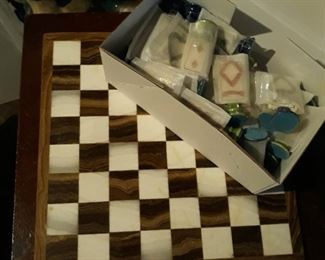 Stone chess board with players 