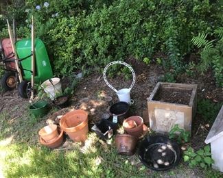 Wheelbarrows and flower pots