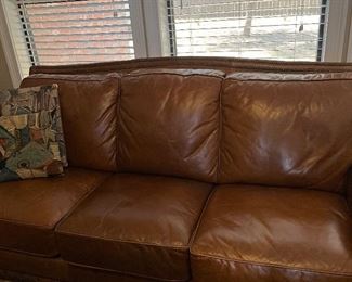 leather sofa with nail head trim