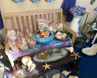 teak bench and ocean decor