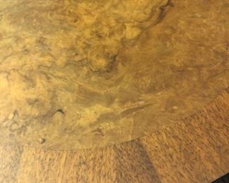 Up close of the rounded edge of thd vintage regency table