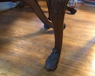 Up close of the fron legs of the chairs tgst go with the vintage regency dining table and chairs