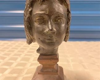 INV #227: Bronze sculpture of young woman's head