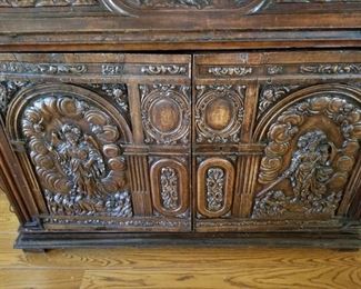 Not shown are original detailed drawers behind the intricately carved doors.