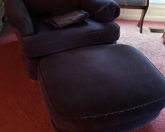 Blue upholstered chair with ottoman