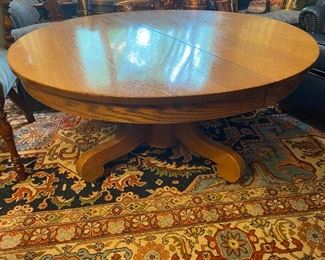 round antique chestnut pedestal cocktail/coffee table