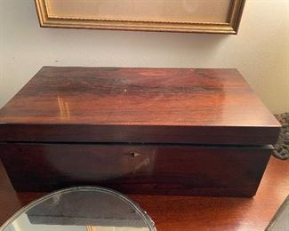 Rosewood writing desk with hidden drawers inside