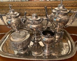 Tray is English silver on copper with bun feet. 4 piece silver plated tea set is by Manning & Robinson, round piece is separate