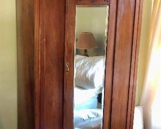 Antique armoire with single mirrored door - with clothes bar inside & drawer at bottom (34”W, 20”D, 83”H)