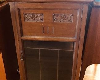 Antique music cabinet with glass door (40"H, 23”W, 15”D)